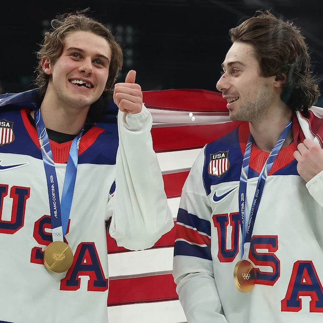 Jack Hughes #86 and Quinn Hughes #43 of Team United States celebrates following the Men's Gold Medal match between Canada and the United States